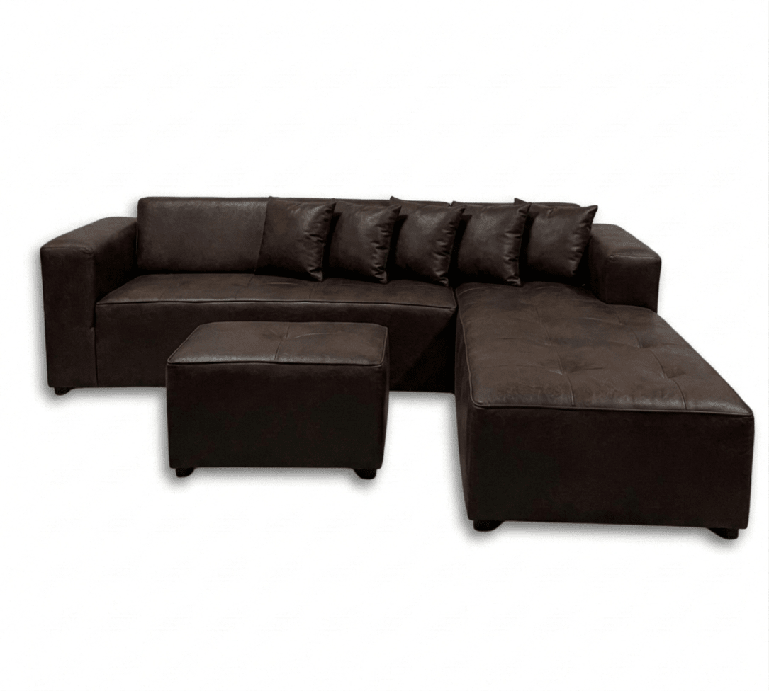 Brown leather sectional sofa with ottoman on a white background