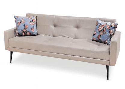 Beige sofa with floral cushions on a white background That Couch Place