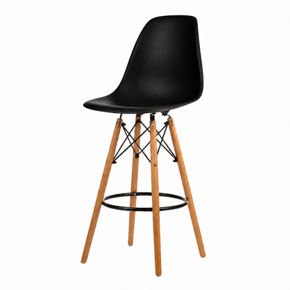 A modern counter stool with a molded black plastic seat and four natural wood legs, featuring a black metal footrest ring and wire support structure.