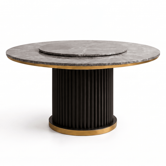 A modern round accent table featuring a dark gray marble top with a matching inset plate, a fluted black pedestal base, and polished gold-toned metal trim.
