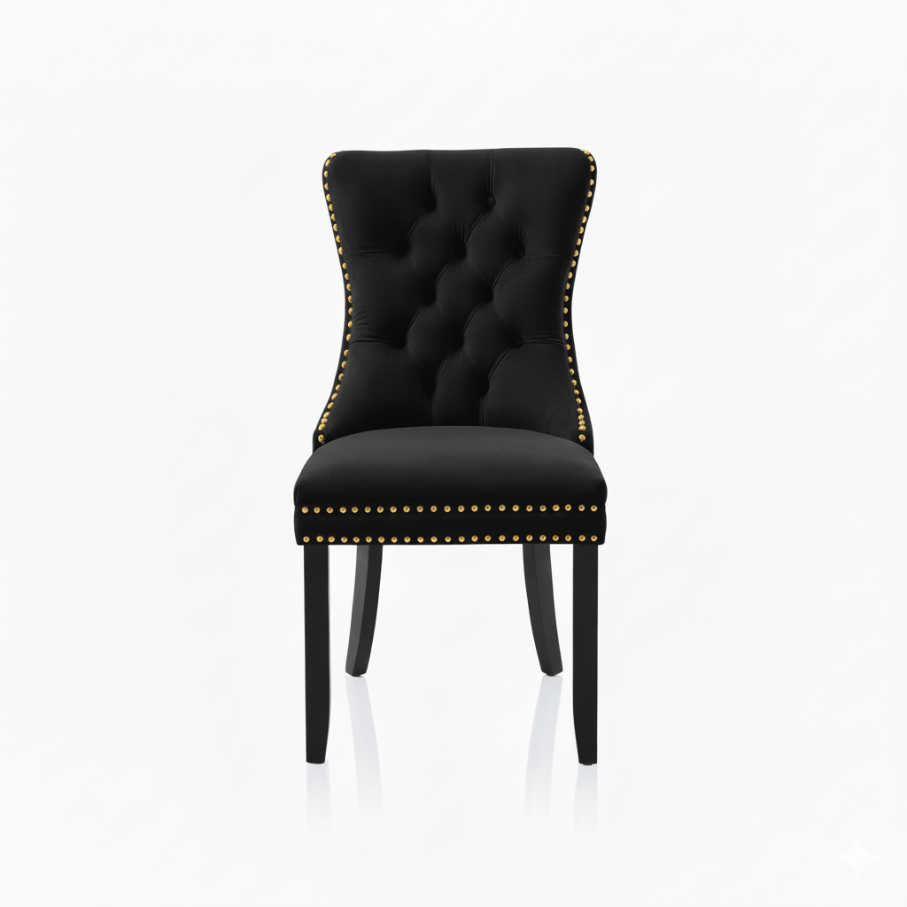 Black upholstered chair with gold nailhead trim on a white background