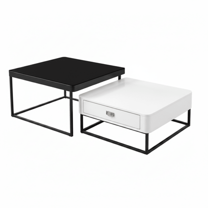 Two modern nesting side tables with black metal frames, one with a black top and the other with a white top and a single drawer, shown on a white background.