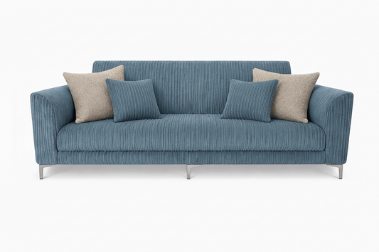 Blue sofa with beige and blue cushions on a white background
