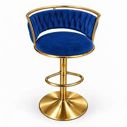 A modern swivel bar stool with a tufted royal blue velvet seat and backrest, supported by a polished gold-finished metal frame and circular pedestal base, shown on a plain white background.