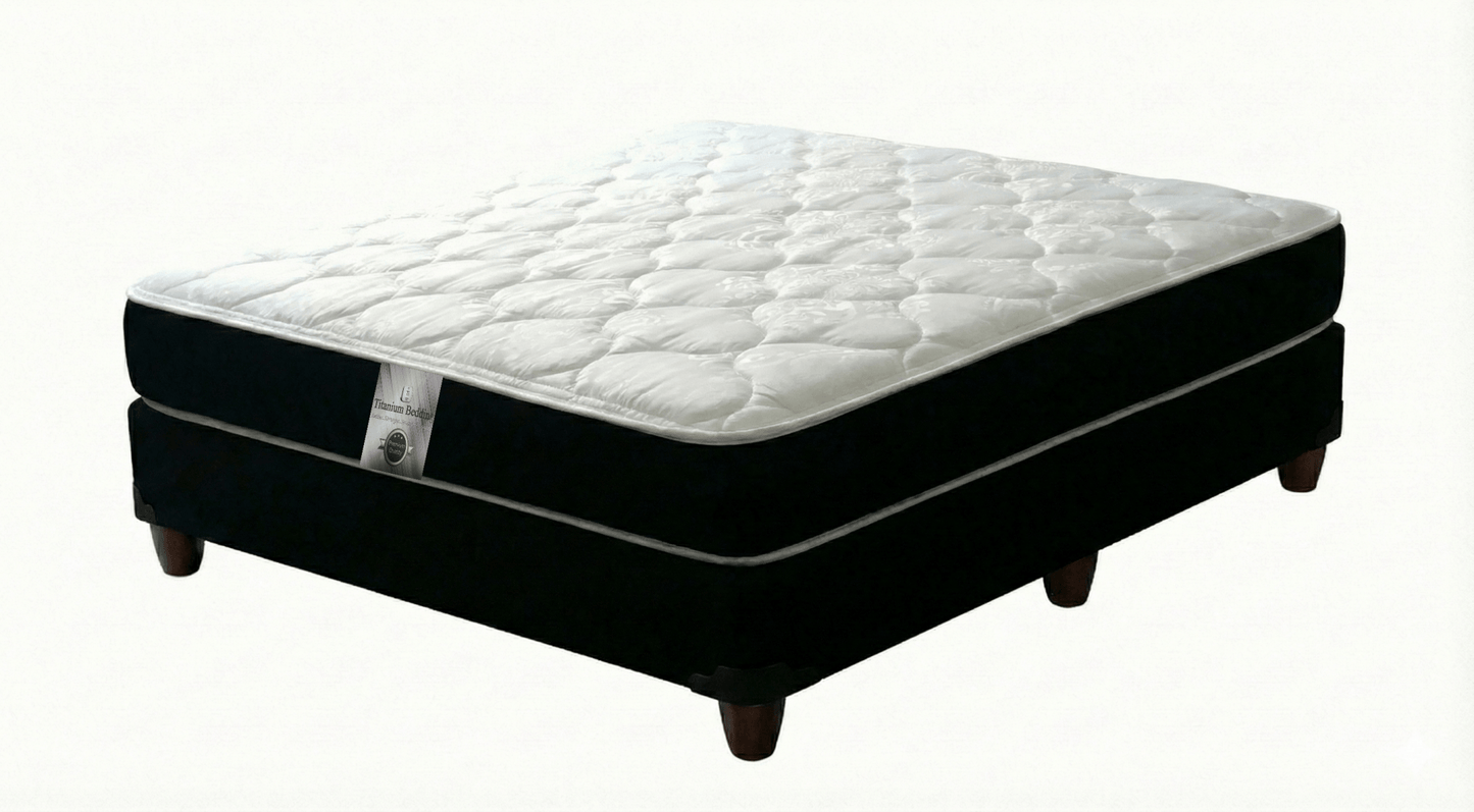 Mattress with a black box spring on a white background That Couch Place