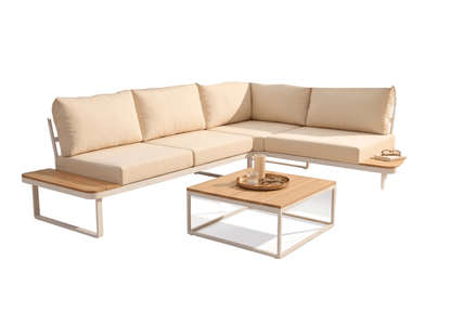 Beige outdoor sectional sofa with wooden coffee table on a patio with ocean view