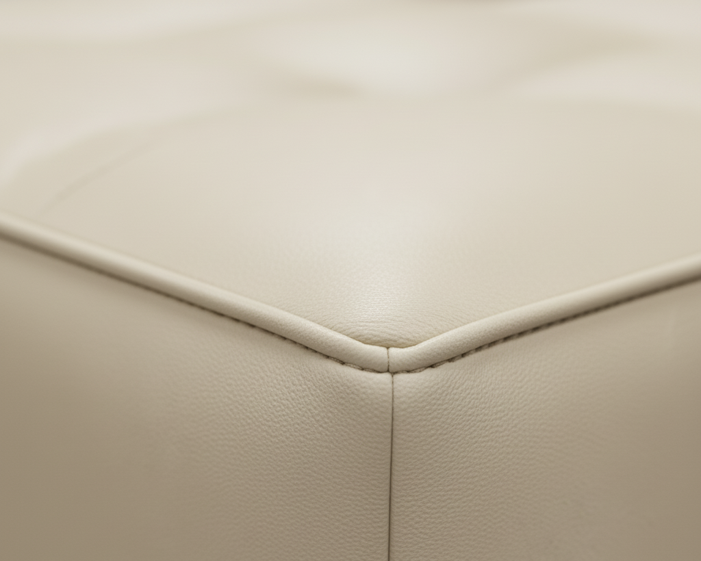 Close-up of beige leather Fabric. That Couch Place