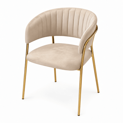 A modern accent chair with a curved backrest and seat upholstered in beige velvet, featuring a polished gold metal frame and legs, shown on a solid white background.
