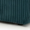 Textured teal cushion on a chair