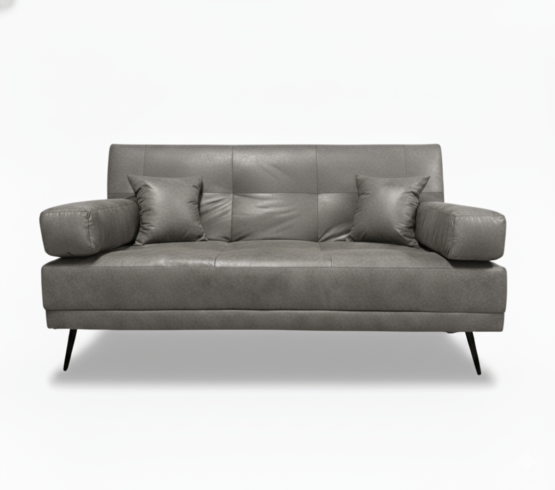 Gray leather double sleeper sofa with four cushions on a white background