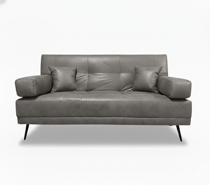 Gray leather double sleeper sofa with four cushions on a white background