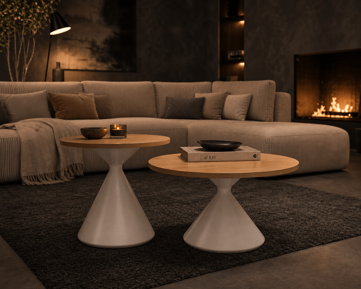 Two modern tulip-style coffee tables in a cozy living room setting with a sectional sofa, fireplace, and dark rug.