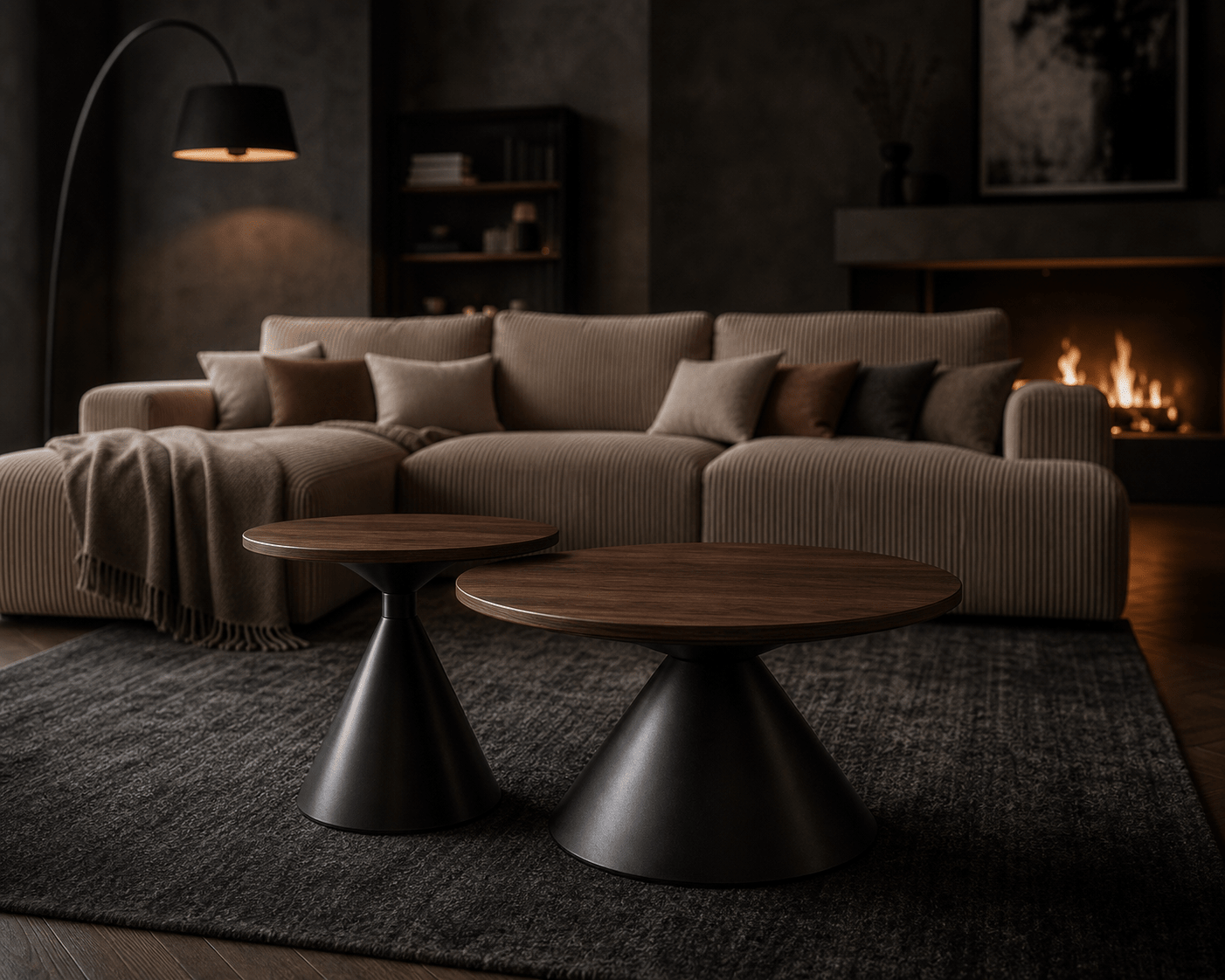 A modern living room scene featuring a beige corduroy sectional sofa with matching pillows, two round nesting coffee tables with dark wood tops and black metal bases, a dark textured rug, a black floor lamp, and a lit fireplace in the background.