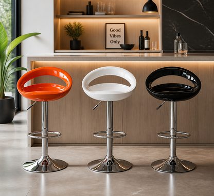 Three modern adjustable bar stools with curved seats in orange, white, and black, featuring chrome metal pedestal bases, shown in front of a kitchen island.