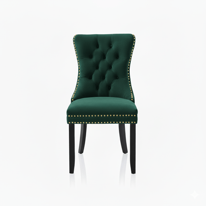 Green velvet chair with tufted backrest and nailhead gold trim on a white background