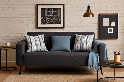 Comfort Couch in an Airbnb apartment with blue decor cushions and picture frame  - That Couch Places