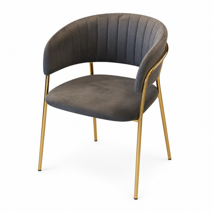 A modern curved dining chair with dark gray velvet upholstery and a polished gold metal frame, shown on a plain white background.