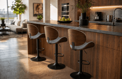 Three modern bar stools with wood-look seats and black metal bases lined up at a kitchen island in a bright, contemporary kitchen.