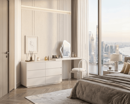 Modern bedroom with large windows, desk, and bed with cityscape view.