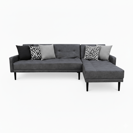 Gray Corner Couch - Sleeper sectional sofa with patterned cushions on a white background That Couch Place