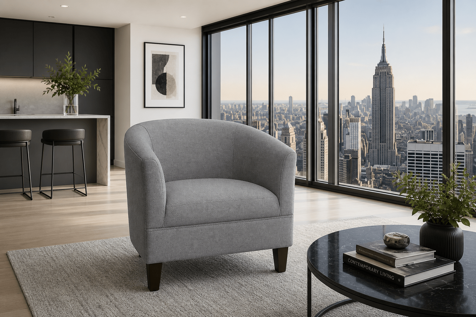 A modern gray upholstered tub chair with dark wooden legs, positioned in a high-rise apartment living room with a city skyline view of the Empire State Building through large floor-to-ceiling windows.
