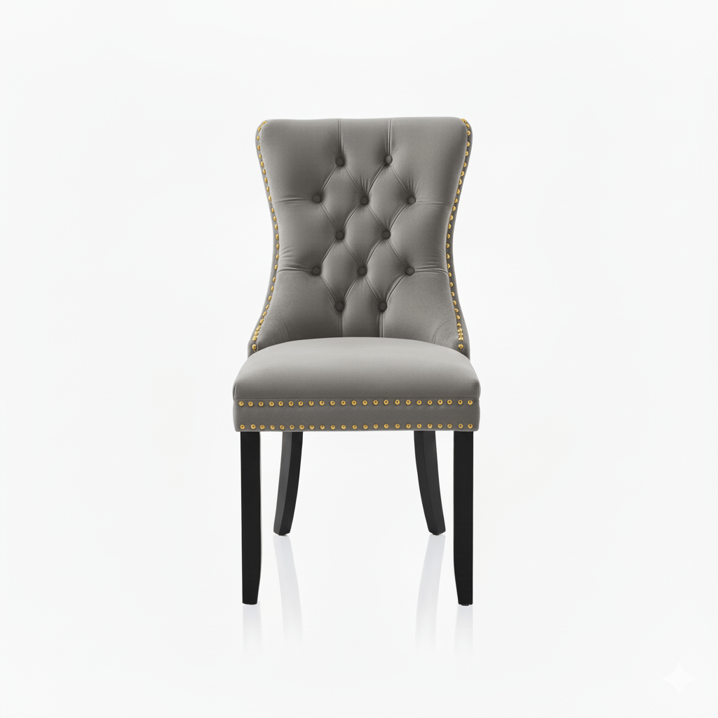 Gray upholstered chair with tufted backrest and nailhead trim on a white background