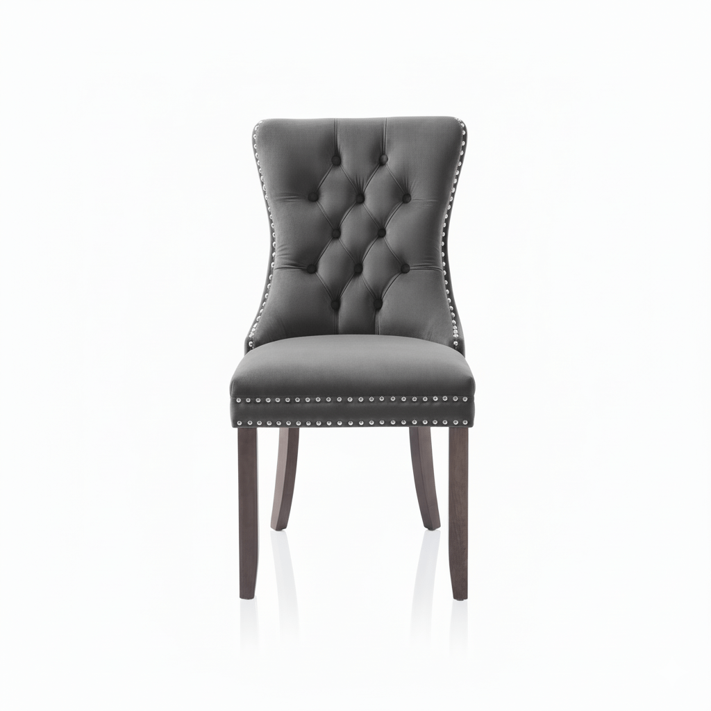 Gray Velvet upholstered chair with silver studded details on a white background