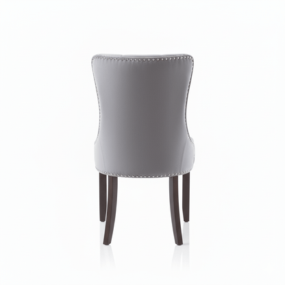 Back of a Gray chair with wooden legs on a white background