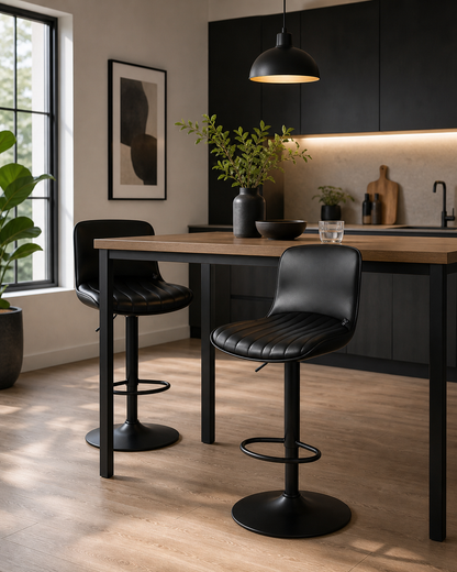 Black modern luxbar bar chair at a table  in a minimalistic environment and black cuboards 
