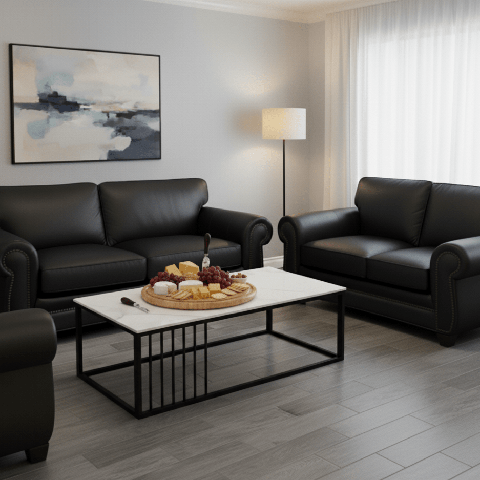 Marble coffee table with steel base in living room with soft black leather couches- That Couch Place