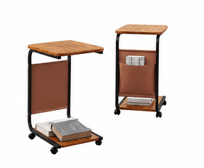 A compact rolling side table shown from two angles on a white background. The table has a light brown wood-grain top, a black metal frame with casters, a brown fabric side panel, and a lower shelf with storage space.