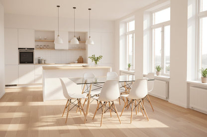 Clear glass dining table with white chairs on a light gray background