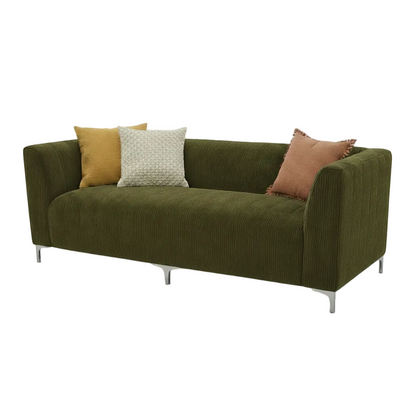 Green sofa with a textured fabric on a white background