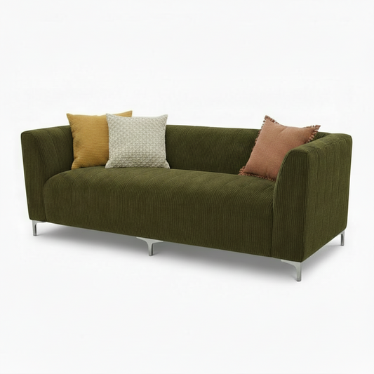 Green sofa with a textured fabric on a white background