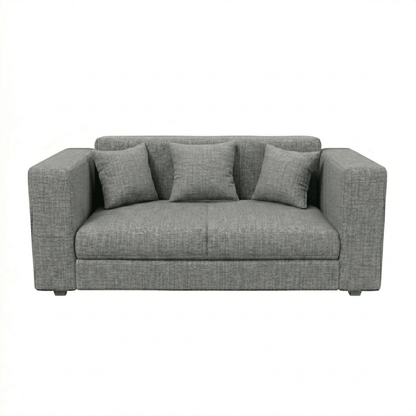 Gray sofa with three cushions on a white background