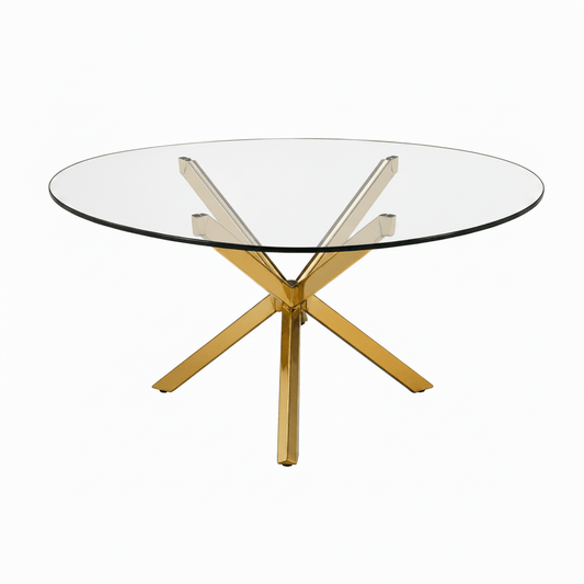 A modern round glass-top dining table with a polished gold-tone metal base featuring an X-shaped central support and four radiating legs, shown on a plain white background.