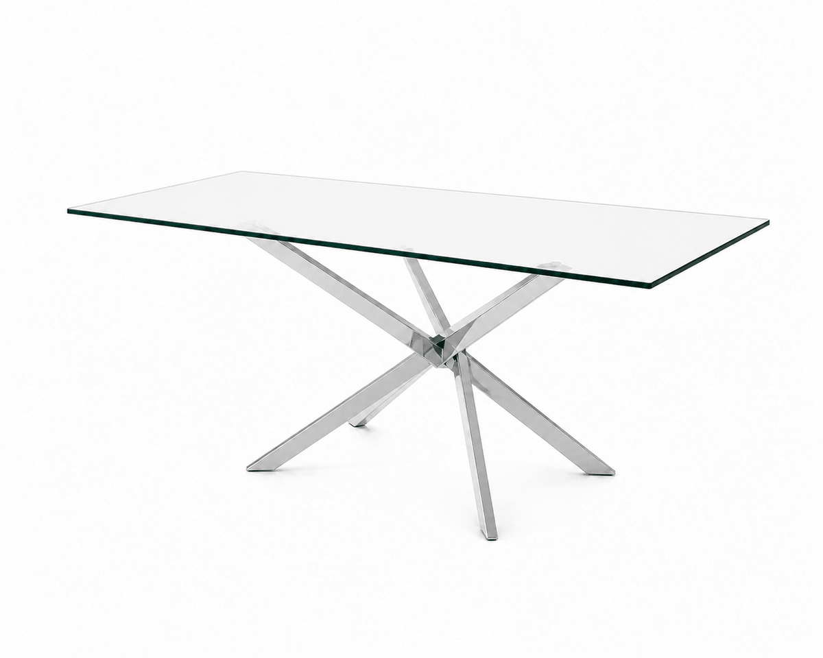 A modern rectangular 6 seater dining table with a clear glass top and a polished silver chrome X-shaped base, shown on a solid white background.