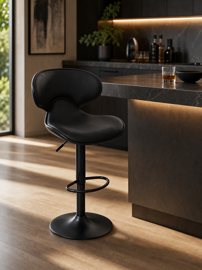A black bar chair with a supporting back, footrest and a lever to adjust height of the chair.