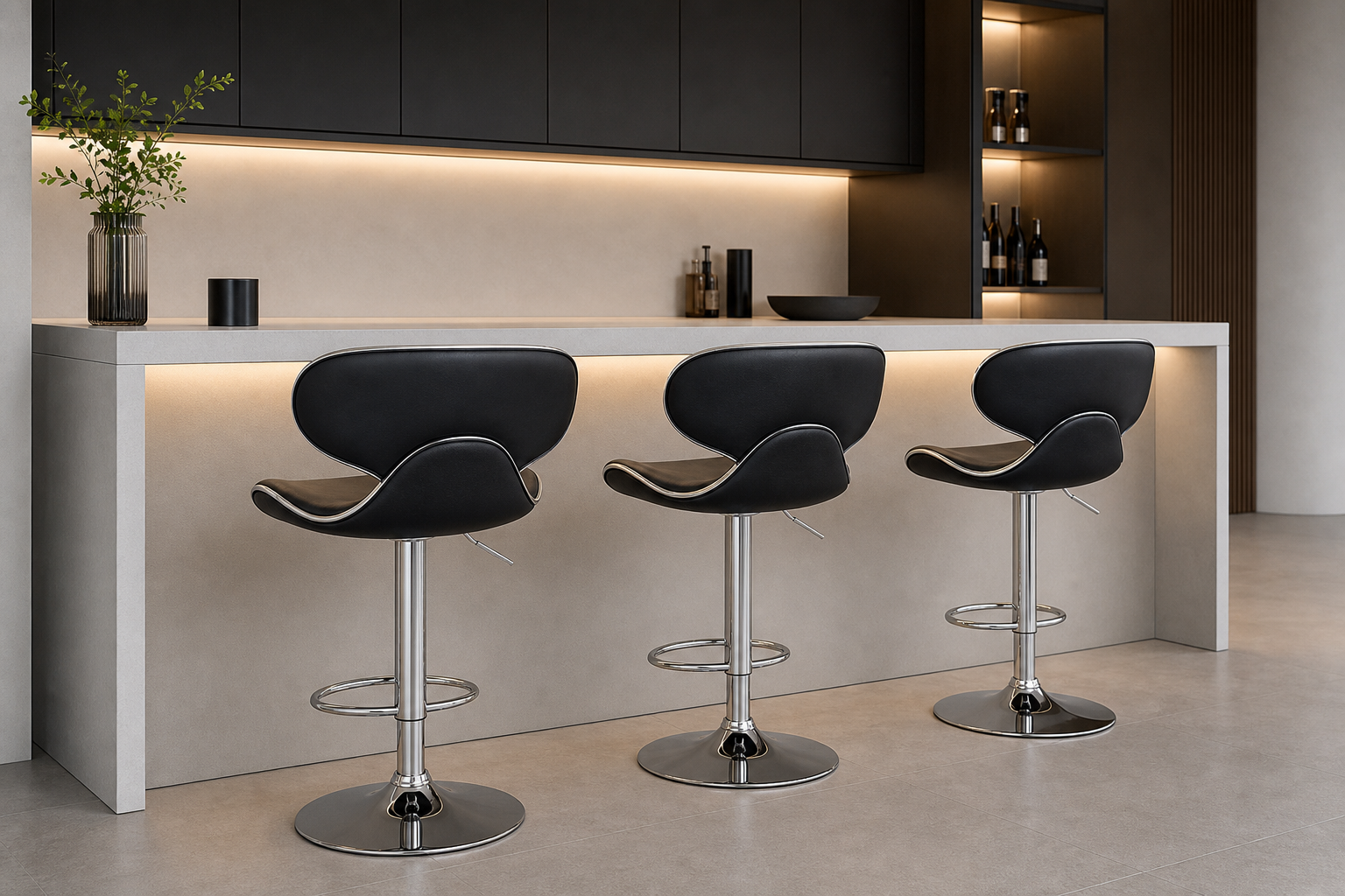Three modern black swivel bar stools with chrome metal bases are arranged in front of a white kitchen island in a contemporary kitchen setting.