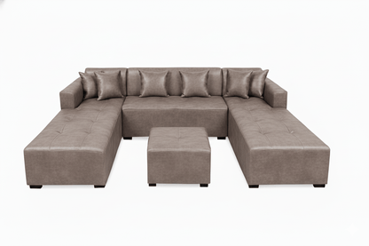 grey u shaped sectional sofa with ottoman on a white background The Couch Place