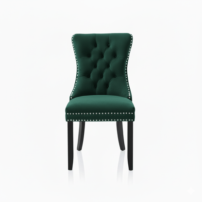 Green velvet chair with silver studded details on a white background