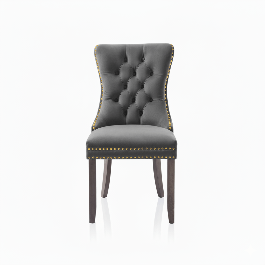 Gray upholstered chair with tufted backrest and gold nailed trim on a white background