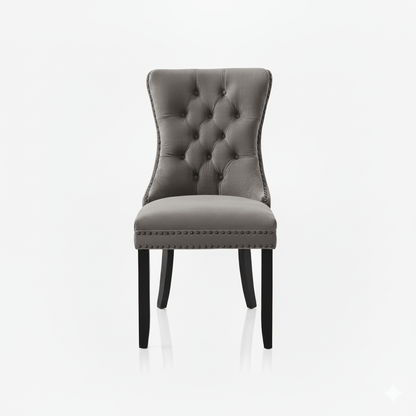 Gray upholstered chair with buttoned backrest on a white background