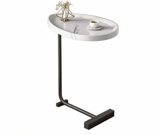 An oval side table with a white marble-patterned top and a black metal C-frame base, shown on a plain white background with a small vase and cup of coffee placed on the tabletop.