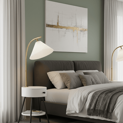 Modern bedroom with a bed, nightstands, and abstract art on the wall.