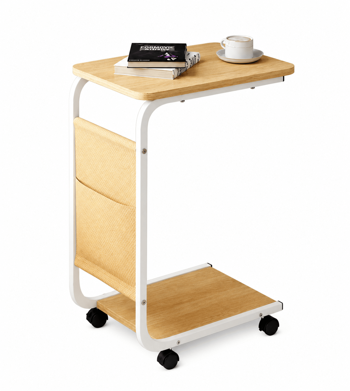 A mobile side desk with a light wood grain top, white metal frame, and black caster wheels. It features a side storage pocket, a lower shelf, and is shown with books and a coffee cup on top, set against a plain white background.