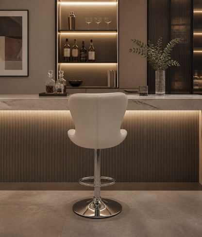 A white modern bar chair, seated at a white counter in  modern enviroment