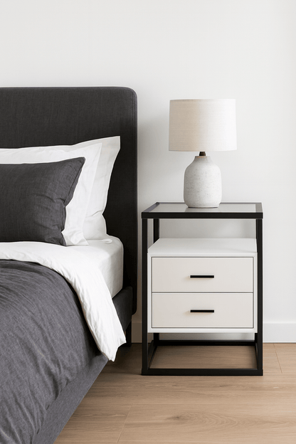 Bedside table in bedroom with bed and decor That Couch Place