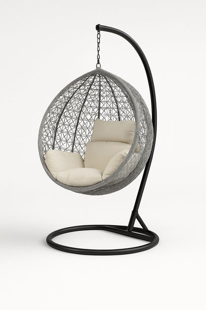 Hanging egg chair with beige cushions on a white background