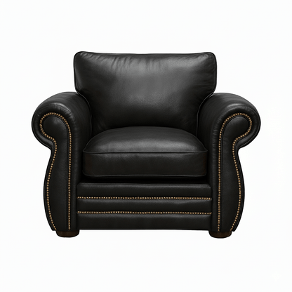 Black leather soft puffy seat armchair with bronze studs on a white background